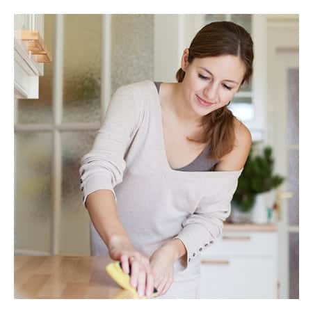 Employee Cleaning Counter Edge